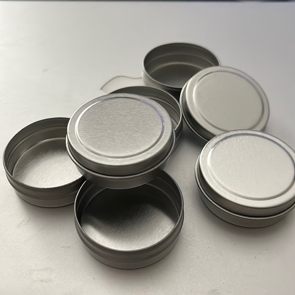 45 count bundle of 1 1/2”round metal containers w/ tops